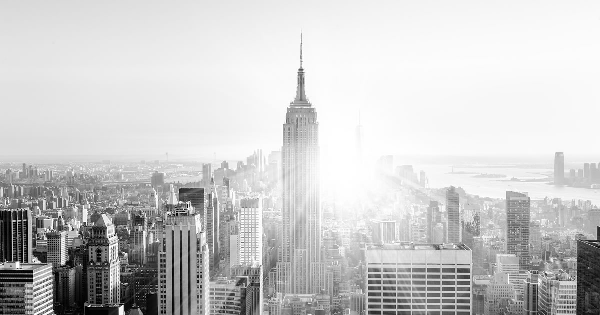 Black and white photo of the New York City skyline showing the Empire State Building