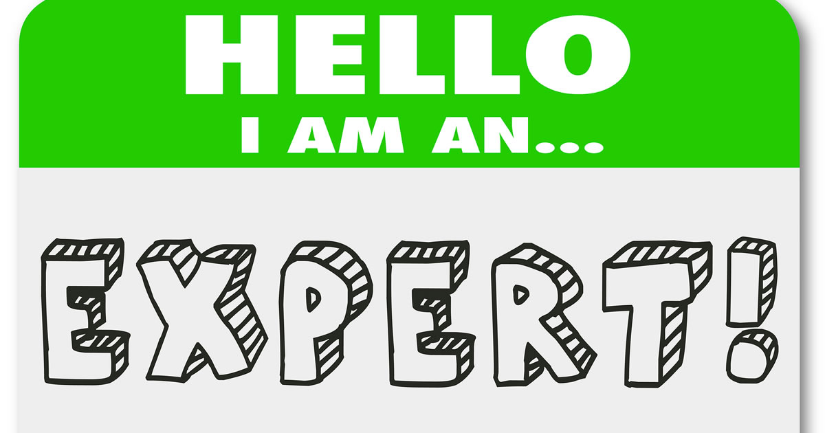 Graphic of a name tag sticker with the words hello I am an expert