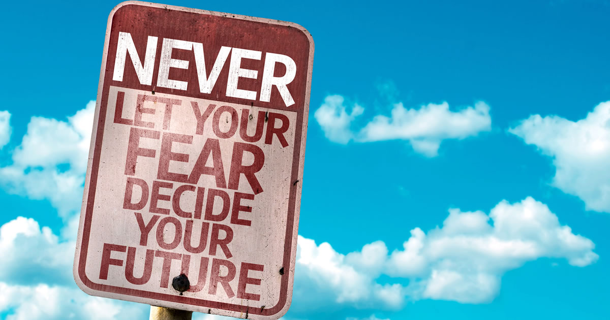 Street sign displaying the words Never Let Your Fear Decide Your Future