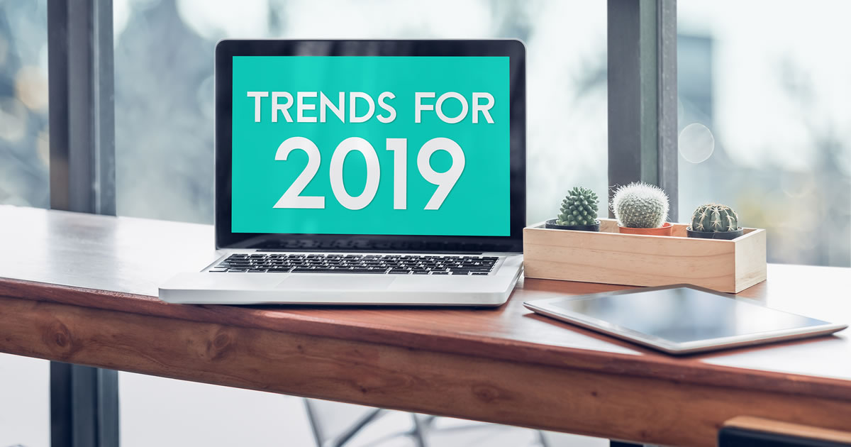 Trends for 2019 written on laptop computer screen on wood table