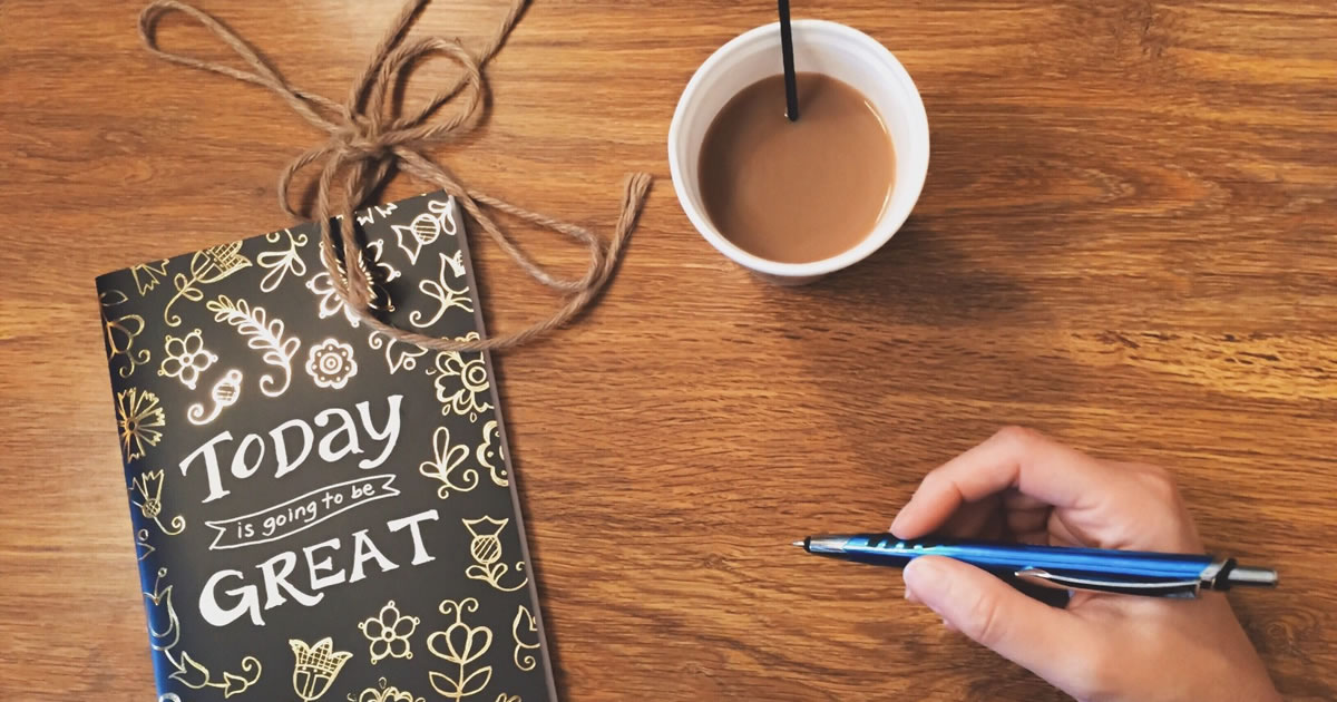 Journal titled “Today is going to be great” and a cup of coffee