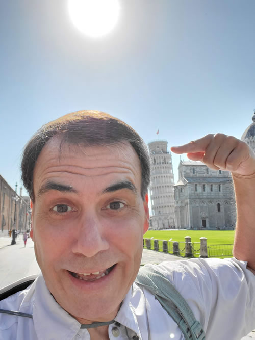 Copywriter Matthew Troncone in front of the leaning tower of Pisa
