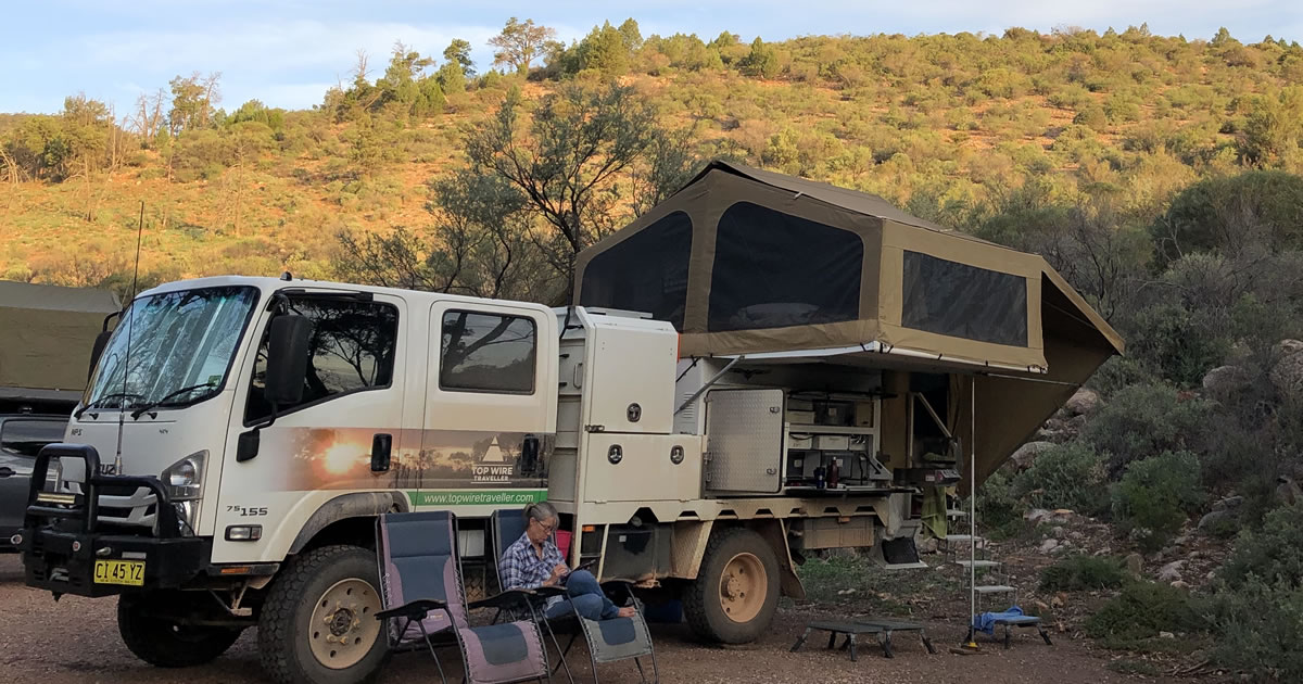 Peta M. working outside by camper in Australia’s Outback