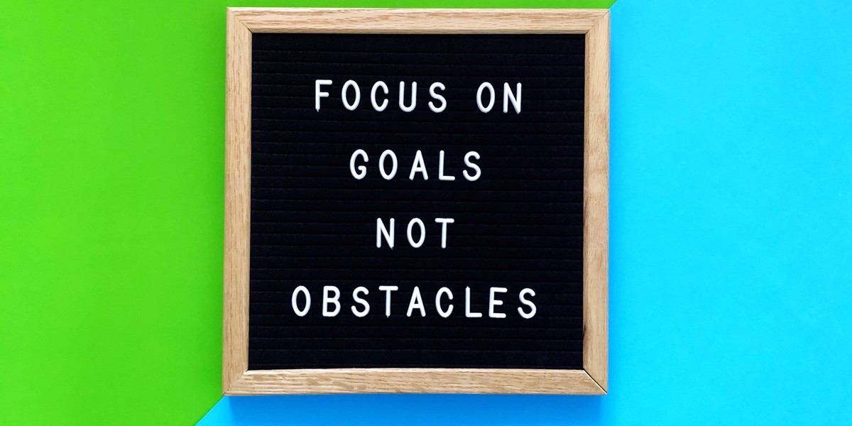 Focus on goals not obstables letters on black board