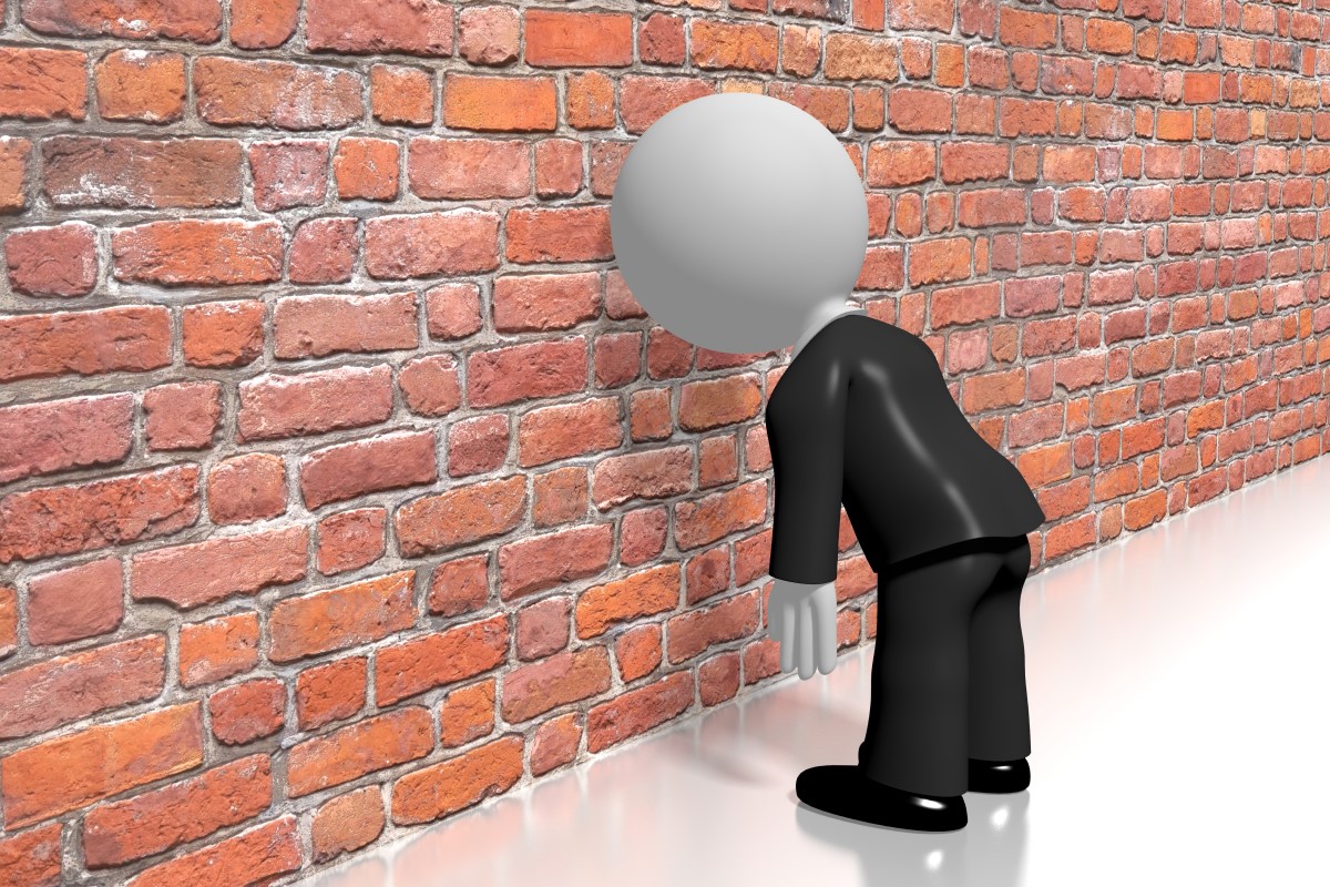 animated character banging his head against a brick wall