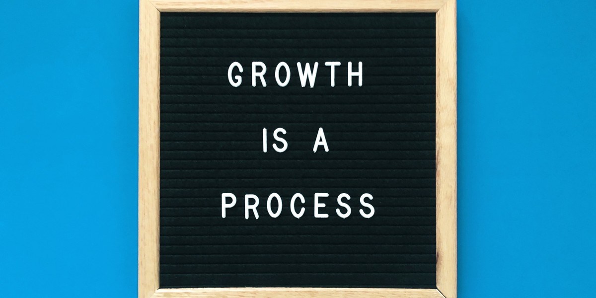 Growth is a process letters on a black board