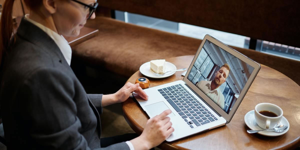 Woman in suit on a video conference