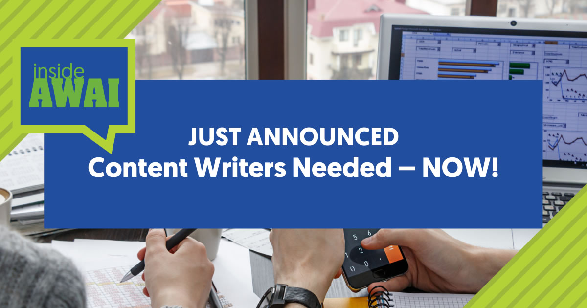 The words Inside AWAI Just Announced Content Writers Needed Now in a blue box on top of a photo of two colleagues' hands working at a desk with paperwork, mobile phone, and laptop