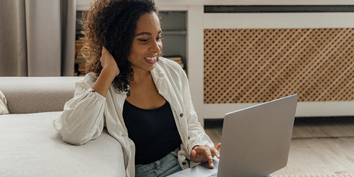 woman writer watching a training webinar on laptop