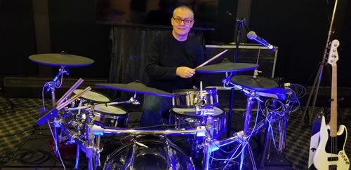 Writer Jim Wright playing the drums
