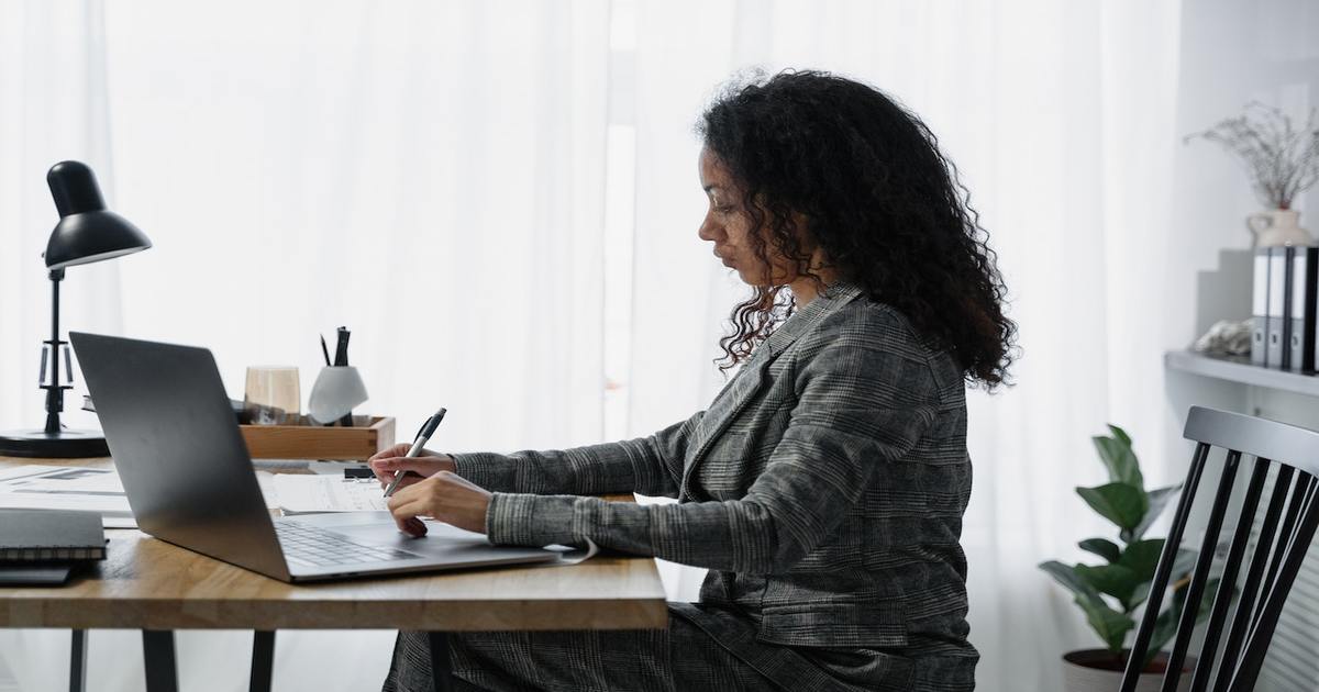 female freelance copyeditor working on laptop