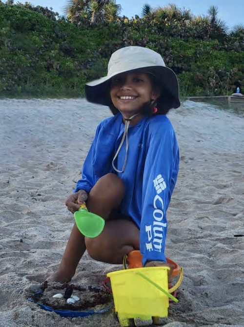 Shameka’s daughter plays in the sand in Delray Beach, Florida