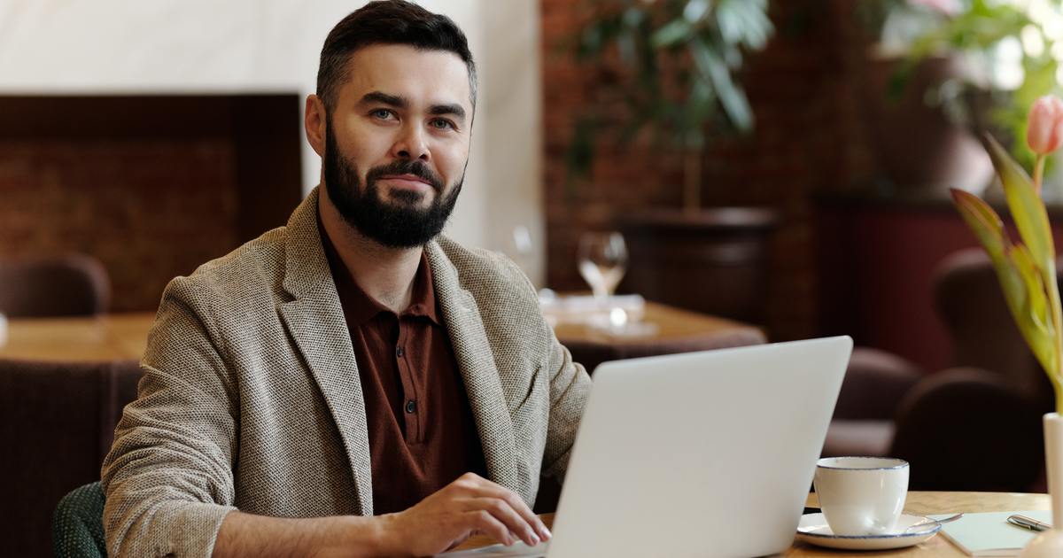 Man smiling while working