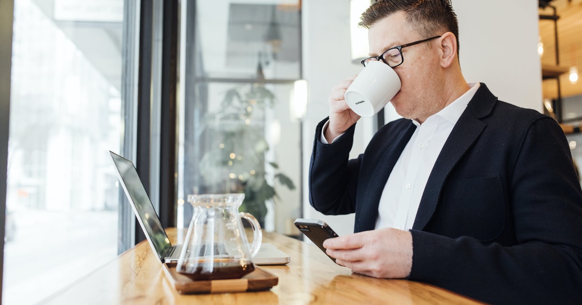 Writer drinking coffee while working