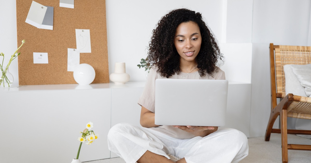 Writer typing on a laptop