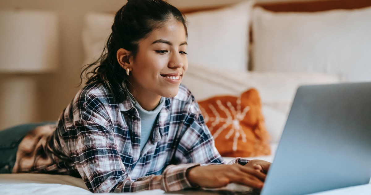 Writer typing on laptop