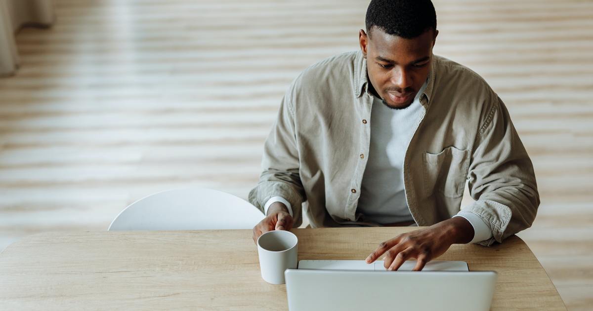 Young man working on a white paper