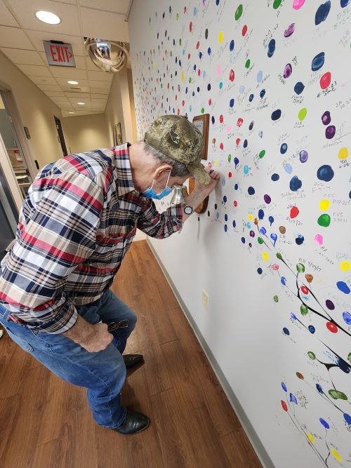 Rebecca’s husband, Ross, got to sign the wall
	at the radiology center when he completed
	his final treatment in San Antonio. Copywriting
	allowed Rebecca to take him to every treatment
	and live in a hotel for months.