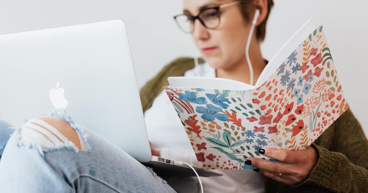 Writer listening to training and taking notes