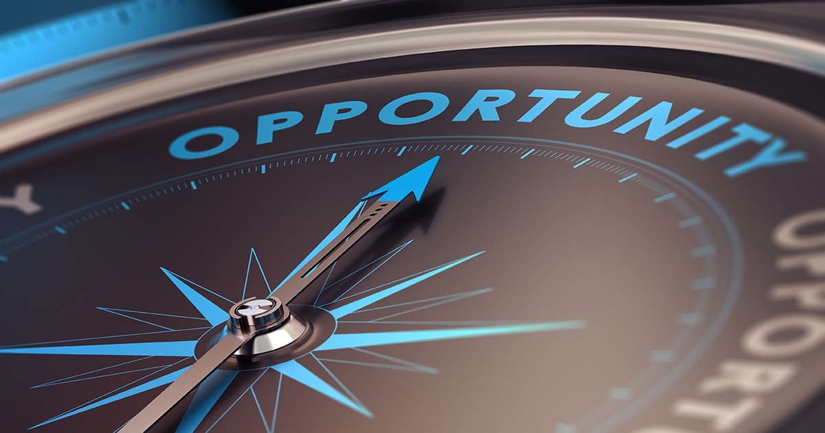 A compass pointing northward tow the word 'Opportunity'