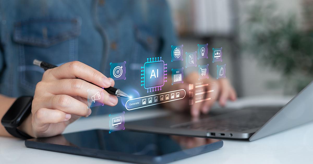 Person using a stylus and tablet beside a laptop, interacting with a floating interface labeled &ldquo;AI&rdquo; that shows icons for content creation, analytics, ads, shopping, and optimization, suggesting AI-powered digital work and automation.