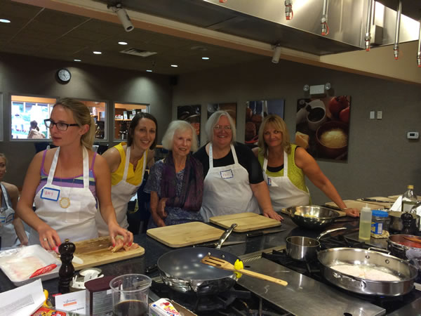 Photo of Amy Wait, Rebecca Matter, Kathleen Yeakle, Pat Coffee and Barb Hume at a cooking class.