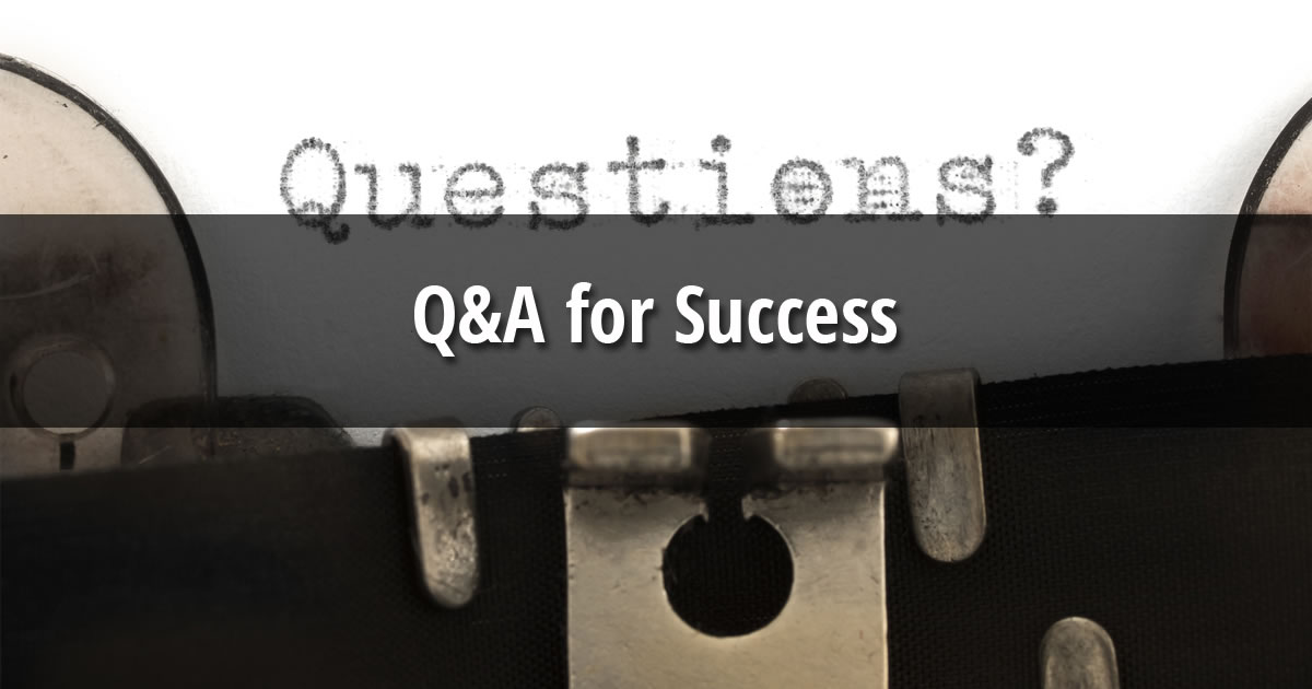 Paper in typewriter with the word Questions and text overlay of Q&A for Success
