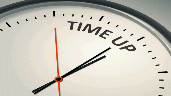 A clock counting towards the words 'TIME UP'